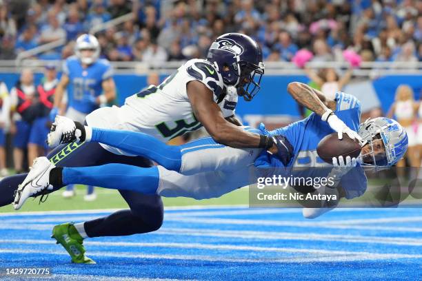 Josh Reynolds of the Detroit Lions scores a touchdown against Mike Jackson of the Seattle Seahawks during the fourth quarter of the game at Ford...