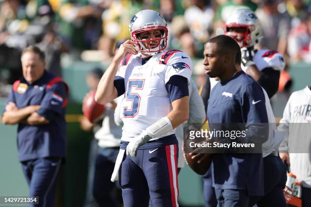 Brian Hoyer of the New England Patriots looks onward during pregame against the Green Bay Packers at Lambeau Field on October 02, 2022 in Green Bay,...