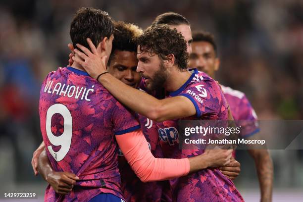 Dusan Vlahovic of Juventus celebrates with team mates after scoring to give the side a 2-0 lead during the Serie A match between Juventus and Bologna...