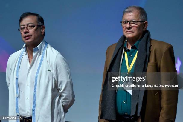 Colombian President Gustavo Petro stands next to Colombian former member of the Revolutionary Armed Forces of Colombia and member of the Comunes...