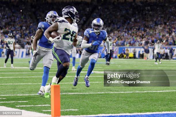 Rashaad Penny of the Seattle Seahawks scores a touchdown in the fourth quarter of the game against the Detroit Lions at Ford Field on October 02,...