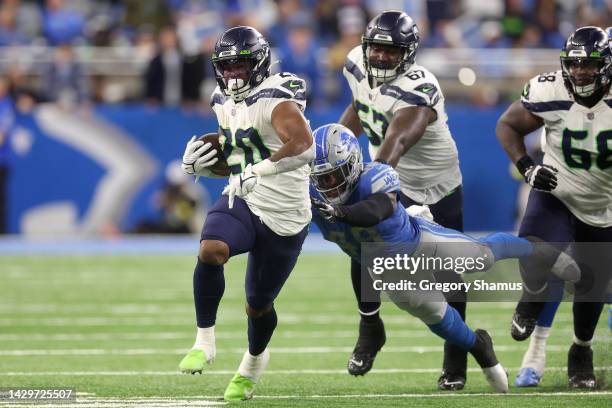 Rashaad Penny of the Seattle Seahawks scores a touchdown in the fourth quarter of the game against the Detroit Lions at Ford Field on October 02,...