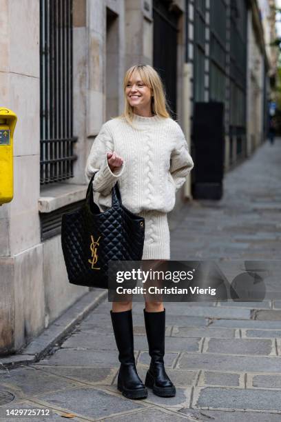 Jeanette Friis Madsen wears black YSL bag, boots, white knitted skirt, jumper outside Ottolinger Paris Fashion Week - Womenswear Spring/Summer 2023 :...