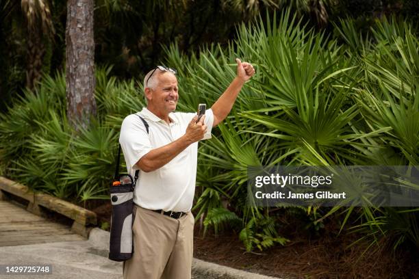 Tim Parsons reacts as his son Luke Parsons places 1st overall in the boys 14-15 age group during The Drive, Chip and Putt Championship Regional...