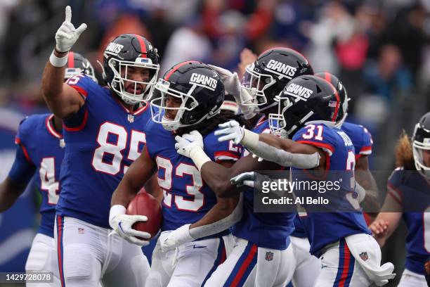 Gary Brightwell of the New York Giants celebrates with teammates after recovering a fumbled punt in the fourth quarter of the game against the...