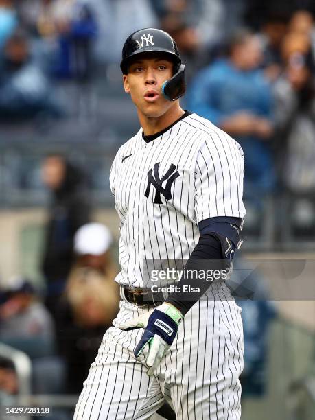 Aaron Judge of the New York Yankees walks back to the dugout after striking out in the seventh inning against the Baltimore Orioles at Yankee Stadium...