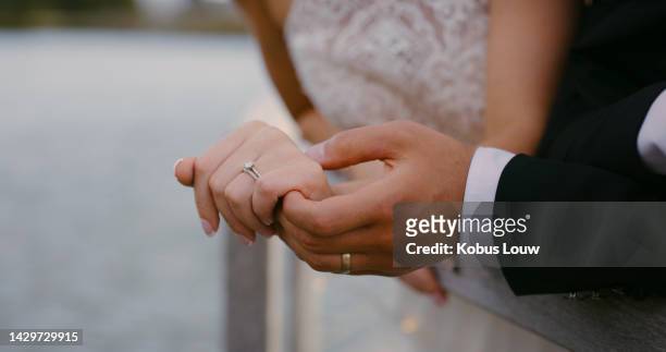hands, love and couple with diamond wedding ring shows trust, jewellery and support in a marriage commitment. people, jewelry and save the date event goals in engagement of bride and groom together - wedding ceremony ring stock pictures, royalty-free photos & images