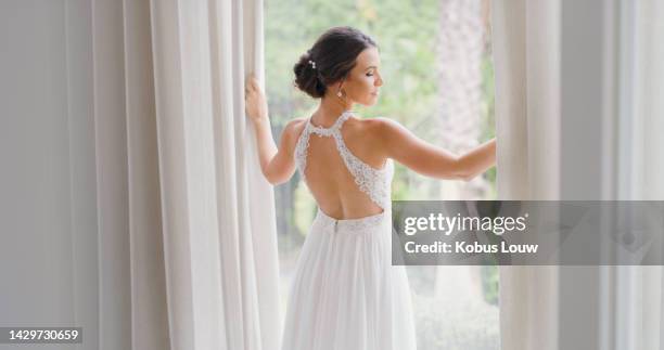 wedding, beauty and bride with a woman getting married and opening a curtain to see the view at a celebration event of tradition. rear view of a beautiful female in a dress before a marriage ceremony - white dress stock pictures, royalty-free photos & images
