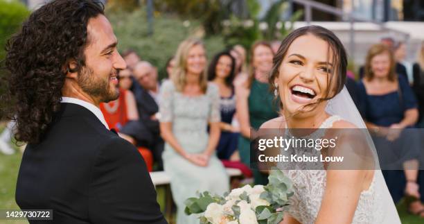 happy married couple during marriage ceremony or reception celebration outdoors. bride and groom make a love commitment to become husband and wife together in a healthy and romance relationship - wedding couple laughing stock pictures, royalty-free photos & images