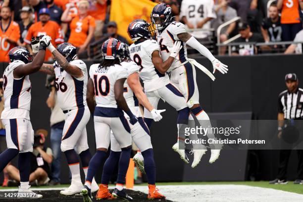 Courtland Sutton of the Denver Broncos celebrates with teammates after scoring a touchdown in the first quarter against the Las Vegas Raiders at...