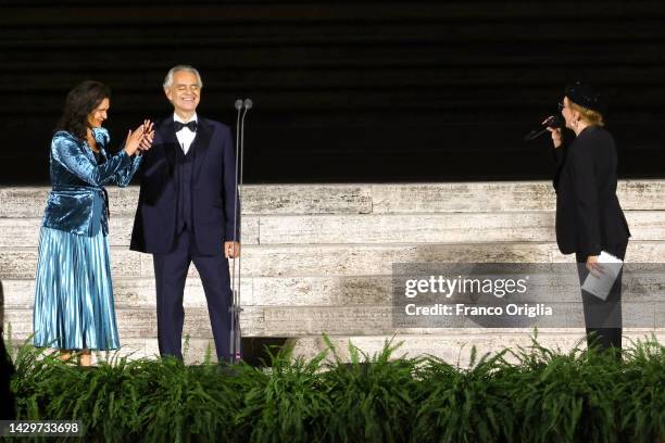 Italian operatic tenor Andrea Bocelli, flanked by is wife Enrica Cenzatti, performs during “Seguimi” a video projection depicting the life of St....