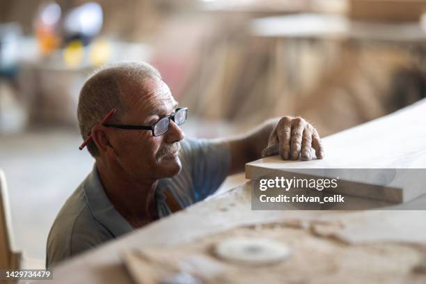 senior male carpenter working - builders hands stock pictures, royalty-free photos & images