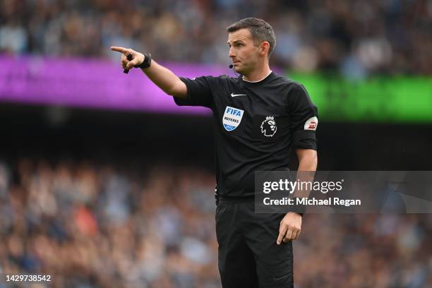 Match official Michael Oliver looks on during the Premier League match between Manchester City and Manchester United at Etihad Stadium on October 02,...