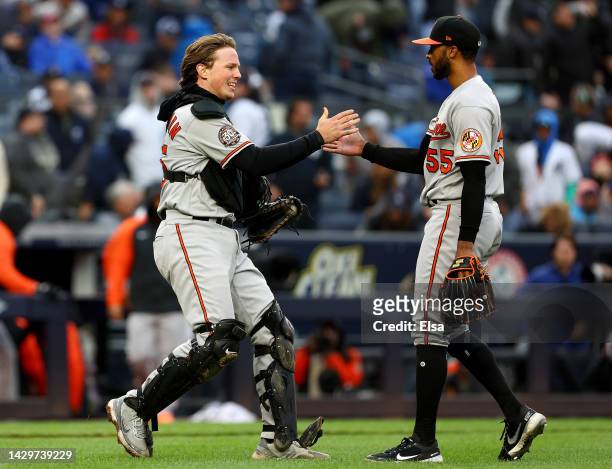 Adley Rutschman and Dillon Tate of the Baltimore Orioles celebrate the win over the New York Yankees at Yankee Stadium on October 02, 2022 in the...
