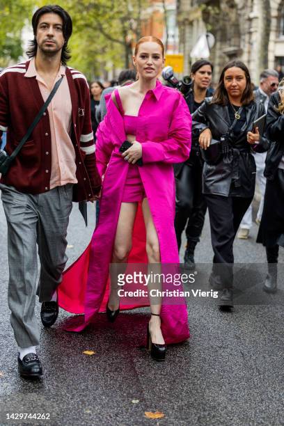 Actress Madelaine Petsch wears pink coat, shorts, cropped top, platform shoes outside Valentino Paris Fashion Week - Womenswear Spring/Summer 2023 :...