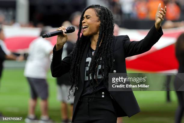 Singer Michelle Williams performs the American national anthem before the game between the Denver Broncos and the Las Vegas Raiders at Allegiant...