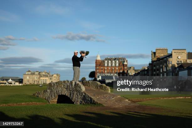 Ryan Fox of New Zealand poses with the trophy on the Swilcan Bridge on the 18th hole after winning the Alfred Dunhill Links Championship at the Old...