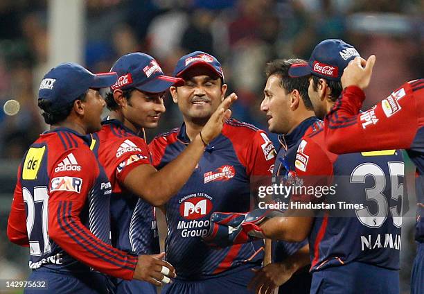 Delhi Daredevils bowler Ajit Agarkar celebrating with teammates after the dismissal of Mumbai Indians batsman Rohit Sharma during the IPL T20 match...