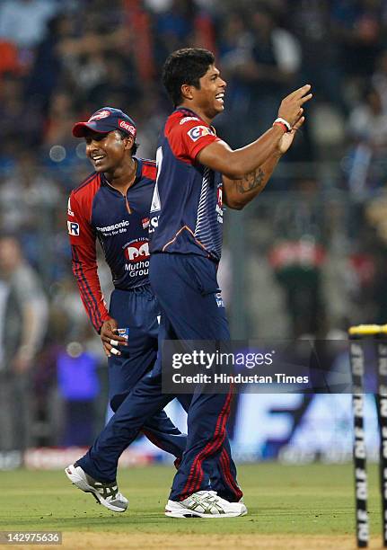 Delhi Daredevils bowler Umesh Yadav celebrating after the dismissal of Mumbai Indians batsman Dinesh Karthik during the IPL T20 match between Mumbai...