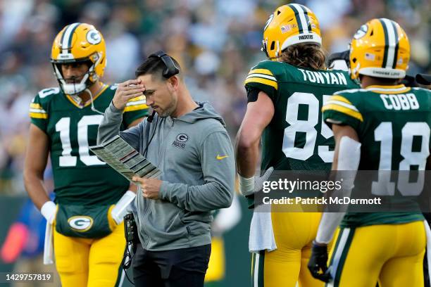 Head coach Matt LaFleur of the Green Bay Packers looks at his play calling sheet during the third quarter against the New England Patriots at Lambeau...