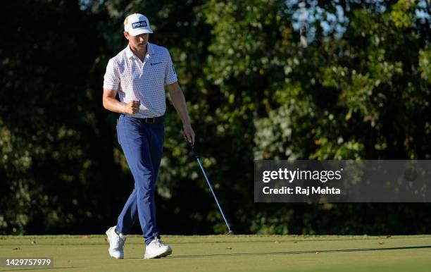 Mackenzie Hughes of Canada reacts to his par putt on the 14th green during the final round of the Sanderson Farms Championship at The Country Club of...