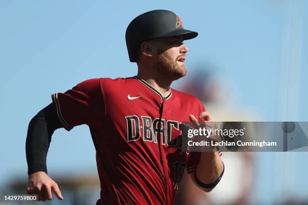 Carson Kelly of the Arizona Diamondbacks runs to home plate to score on a double by Jake McCarthy in the top of the fifth inning against the San...