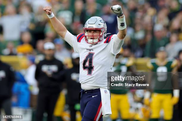 Bailey Zappe of the New England Patriots reacts to a touchdown during the fourth quarter against the Green Bay Packers at Lambeau Field on October...