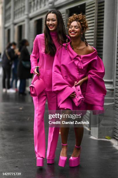 Lily Chee is seen wearing a pink Valentino top and pants with pink Valentino back and shoes with Paola Locatelli wearing a pink Valentino coat, bag...