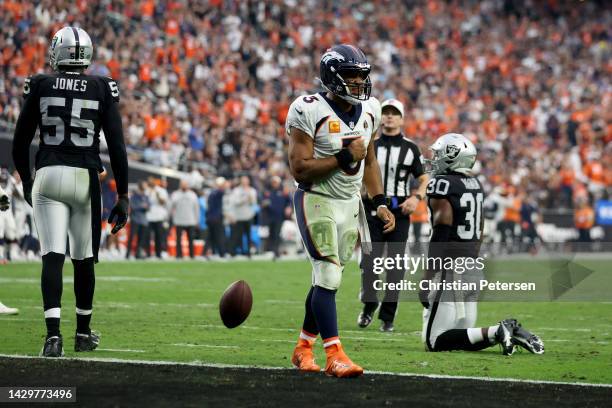 Russell Wilson of the Denver Broncos celebrates after scoring a touchdown in the fourth quarter against the Las Vegas Raiders at Allegiant Stadium on...