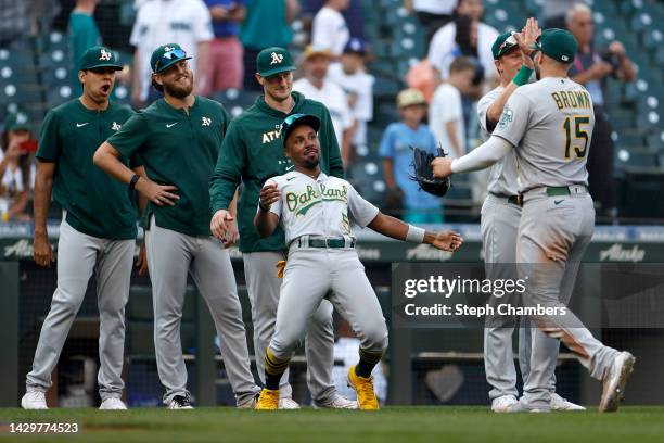 Tony Kemp of the Oakland Athletics celebrates with teammates after they beat the Seattle Mariners 10-3 at T-Mobile Park on October 02, 2022 in...