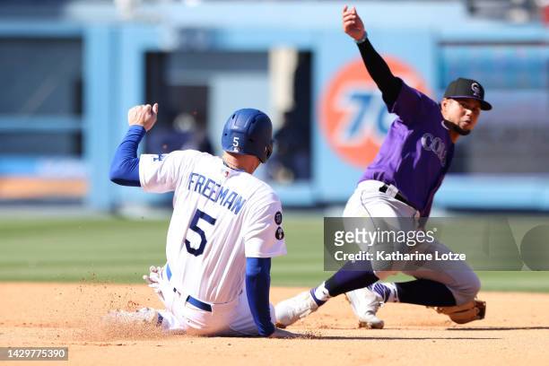 Freddie Freeman of the Los Angeles Dodgers slides into second as he is tagged out by Ezequiel Tovar of the Colorado Rockies in the sixth inning at...