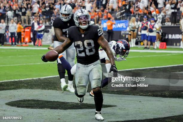 Josh Jacobs of the Las Vegas Raiders celebrates after scoring a touchdown in the fourth quarter against the Denver Broncos at Allegiant Stadium on...