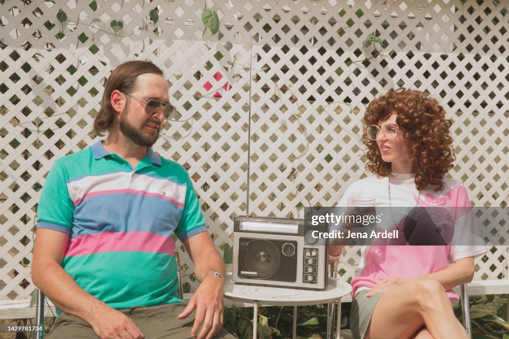 Retro 1980s Couple Candid Portrait of Funny 1980s Style Fashion and 80s Hairstyles