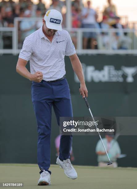 Mackenzie Hughes of Canada reacts after putting in to win on the second playoff hole against Sepp Straka of Austria on the 18th green during the...