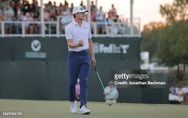 Mackenzie Hughes of Canada reacts after putting in to win on the second playoff hole against Sepp Straka of Austria on the 18th green during the...