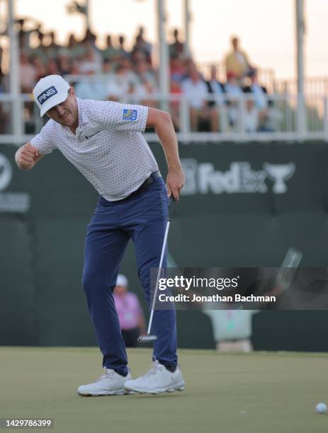 Mackenzie Hughes of Canada reacts after putting in to win on the second playoff hole against Sepp Straka of Austria on the 18th green during the...