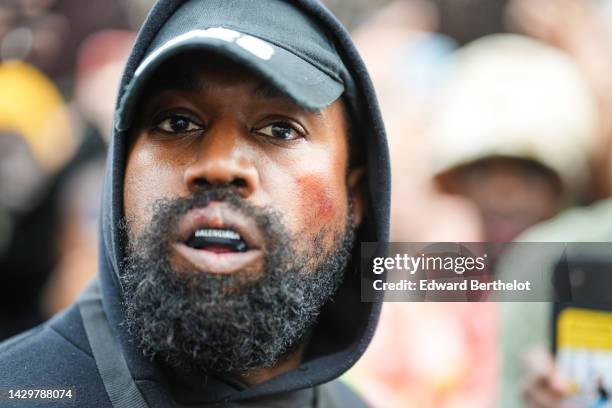 Kanye West aka Ye is seen wearing a Balenciaga boxing mouthguard, outside Givenchy, during Paris Fashion Week - Womenswear Spring/Summer 2023 - Day...