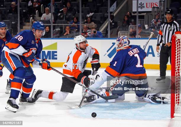Jakub Skarek of the New York Islanders makes the save on Tony DeAngelo of the Philadelphia Flyers with one second left in the third period at the UBS...