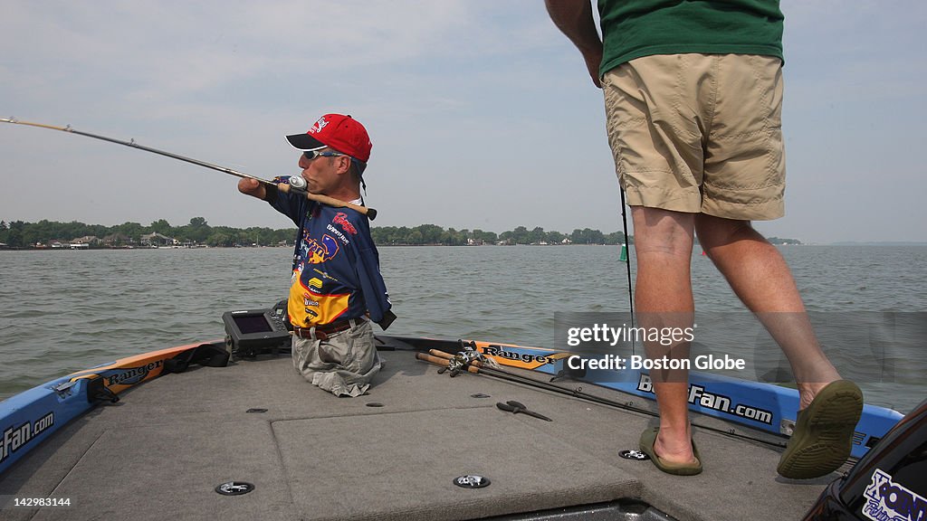 Clay Dyer, a pro-angler on the FLW Bass Pro Team, casts into the ...