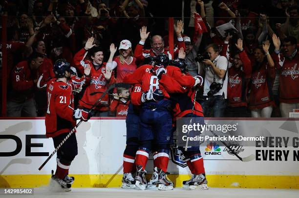 Alexander Semin celebrates with Alex Ovechkin, Brooks Laich, and Nicklas Backstrom of the Washington Capitals after scoring a goal against the Boston...