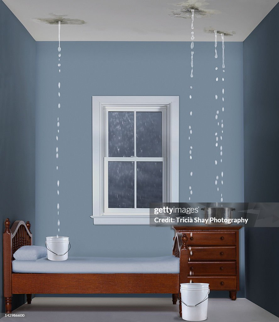 Toy bedroom with water dripping from ceiling