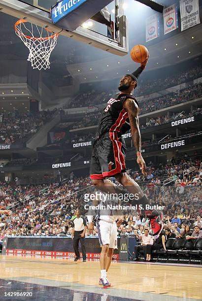 LeBron James of the Miami Heat goes to the basket for a dunk during the game against the New Jersey Nets on April 16, 2012 at the Prudential Center...
