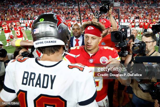 Patrick Mahomes of the Kansas City Chiefs shakes hands with Tom Brady of the Tampa Bay Buccaneers after defeating the Tampa Bay Buccaneers 41-31 at...
