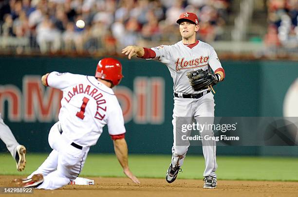 Steve Lombardozzi of the Washington Nationals is forced out at second base by Jed Lowrie of the Houston Astros at Nationals Park on April 16, 2012 in...