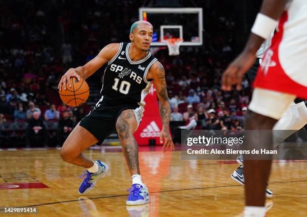 Jeremy Sochan of the San Antonio Spurs dribbles the ball during the game against the Houston Rockets at Toyota Center on October 02, 2022 in Houston,...