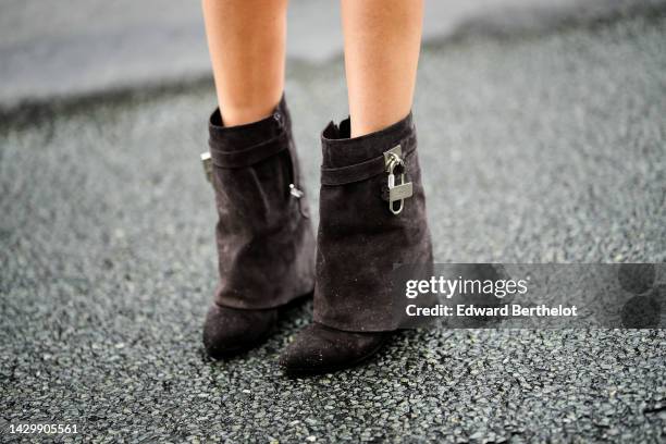 Natalia Verza wears dark brown suede wedge heels Shark ankle boots from Givenchy , outside Givenchy, during Paris Fashion Week - Womenswear...