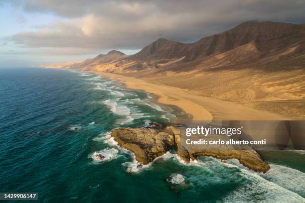 aerial view taken by drone of el islote, cofete beach, fuerteventura, canary island, spain, europe - insel fuerteventura stock-fotos und bilder