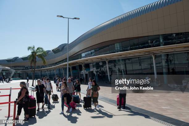 Tourists arrive with their luggage at Faro Airport, officially Gago Coutinho Airport on September 22, 2022 in Faro, Portugal.
