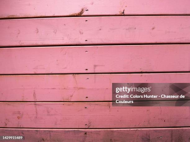 wooden plank wall painted and weathered in pink in montreal, qc, canada - vieux montréal stock pictures, royalty-free photos & images