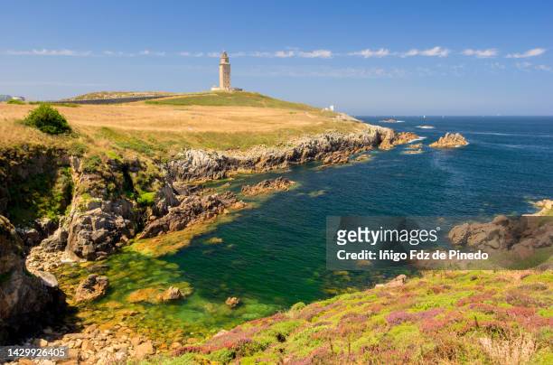 coast of a coruña with the tower of hercules in the background , a coruña, galicia, spain. - la coruña imagens e fotografias de stock